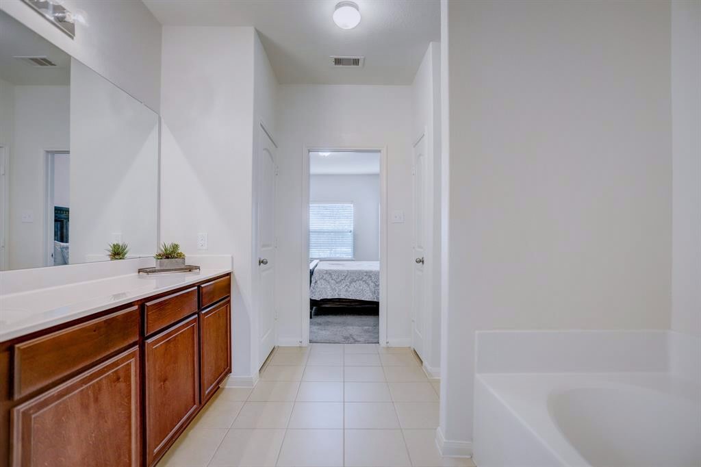 1303 Emerald Stone Drive Rosharon, TX 77583 - Photo 14 of 25 Oversized primary bathroom with separate shower.