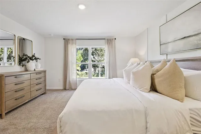 a bedroom with a bed and a dresser