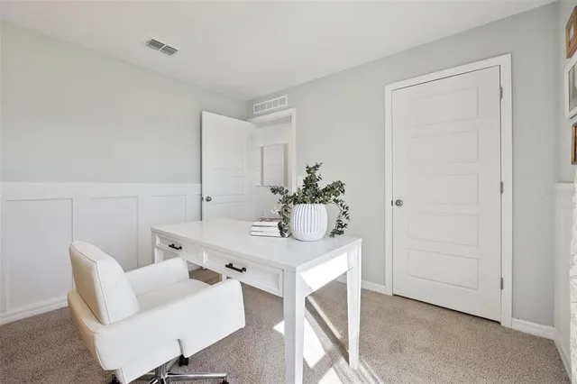 a workspace with furniture and window