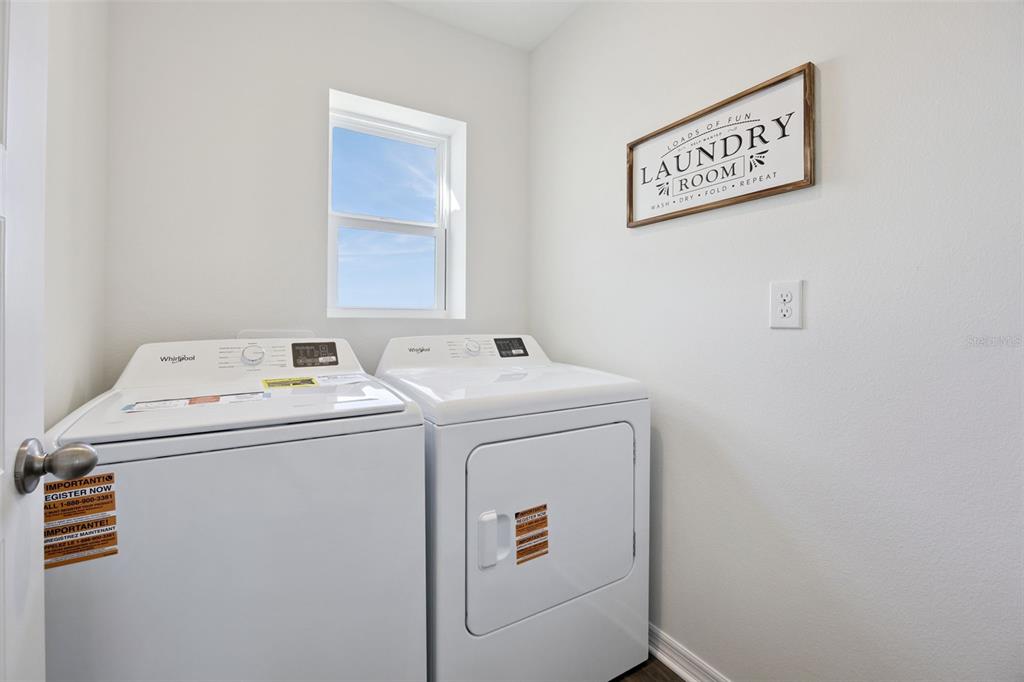3417 Nettle Loop Tavares, FL 32778 - Photo 28 of 29 a utility room with dryer and washer