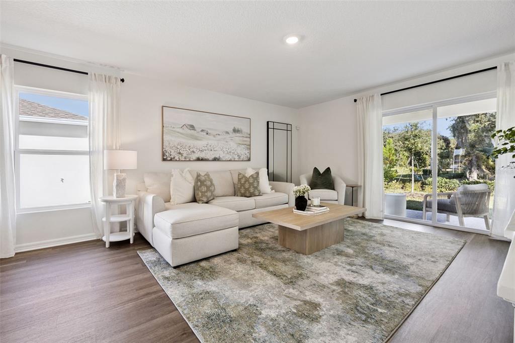 3417 Nettle Loop Tavares, FL 32778 - Photo 6 of 29 a living room with furniture and a large window