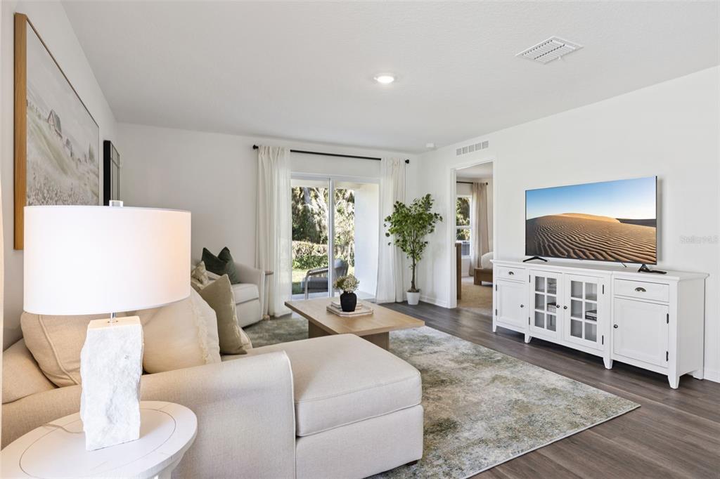 3417 Nettle Loop Tavares, FL 32778 - Photo 8 of 29 a living room with furniture and a flat screen tv