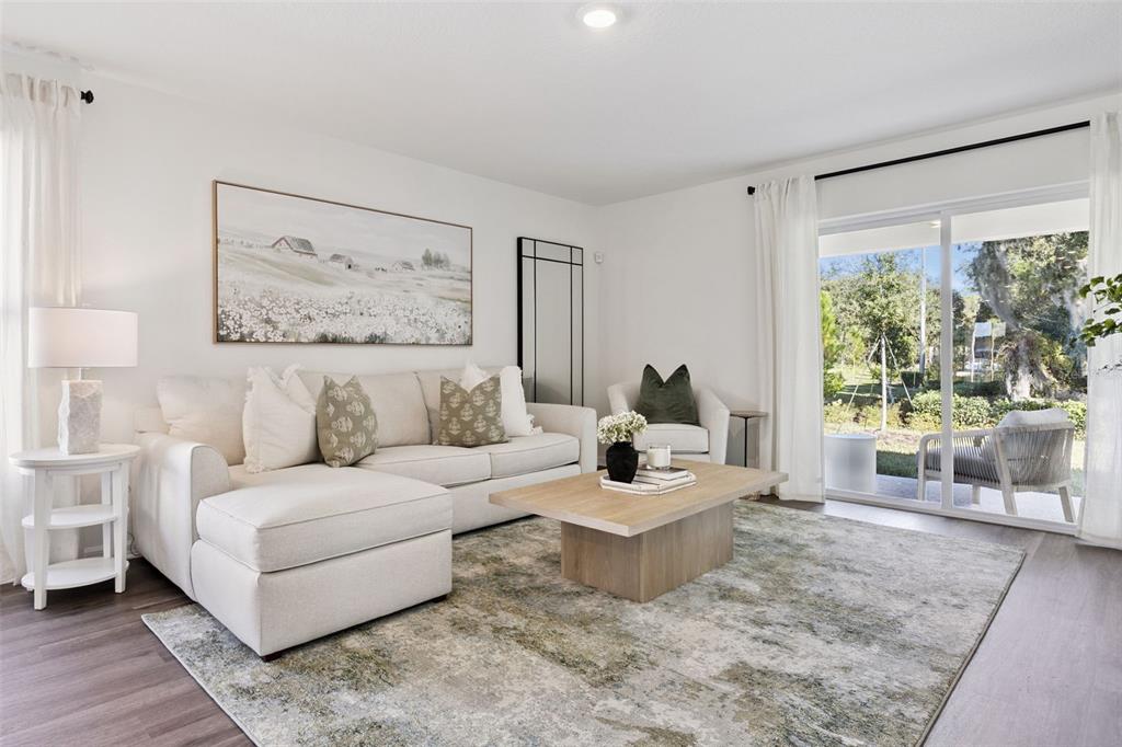 3417 Nettle Loop Tavares, FL 32778 - Photo 9 of 29 a living room with furniture and a large window