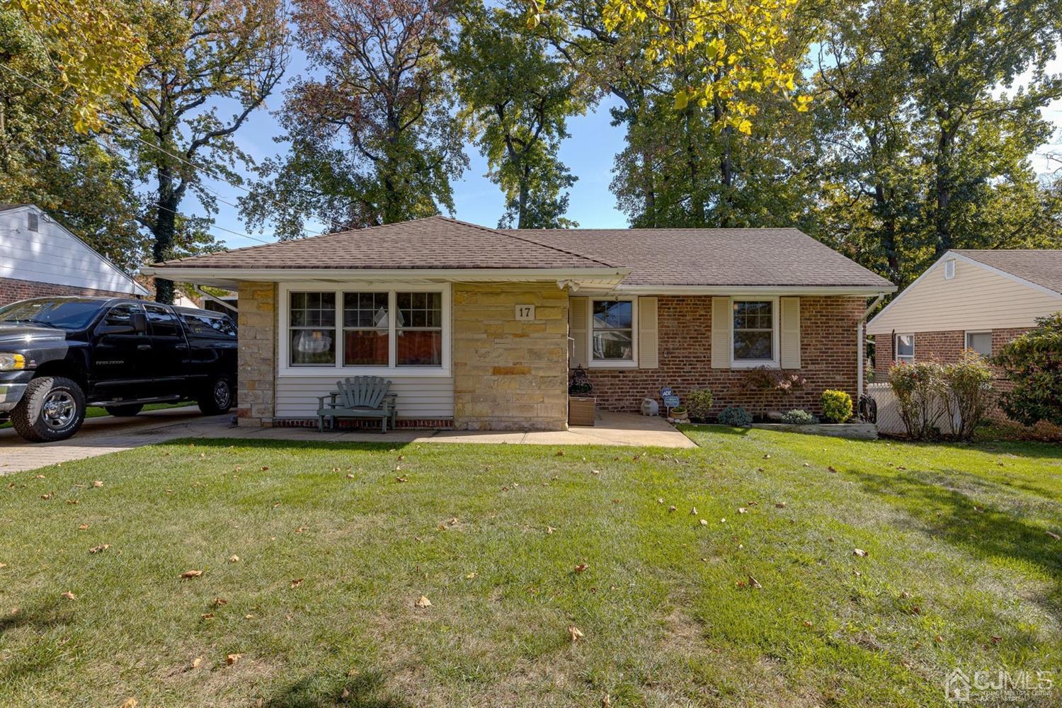 17 Melville Road Edison, NJ 08817 - Photo 3 of 26 a front view of a house with a garden