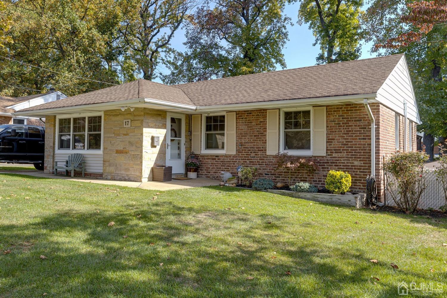17 Melville Road Edison, NJ 08817 - Photo 4 of 26 a front view of a house with yard and porch