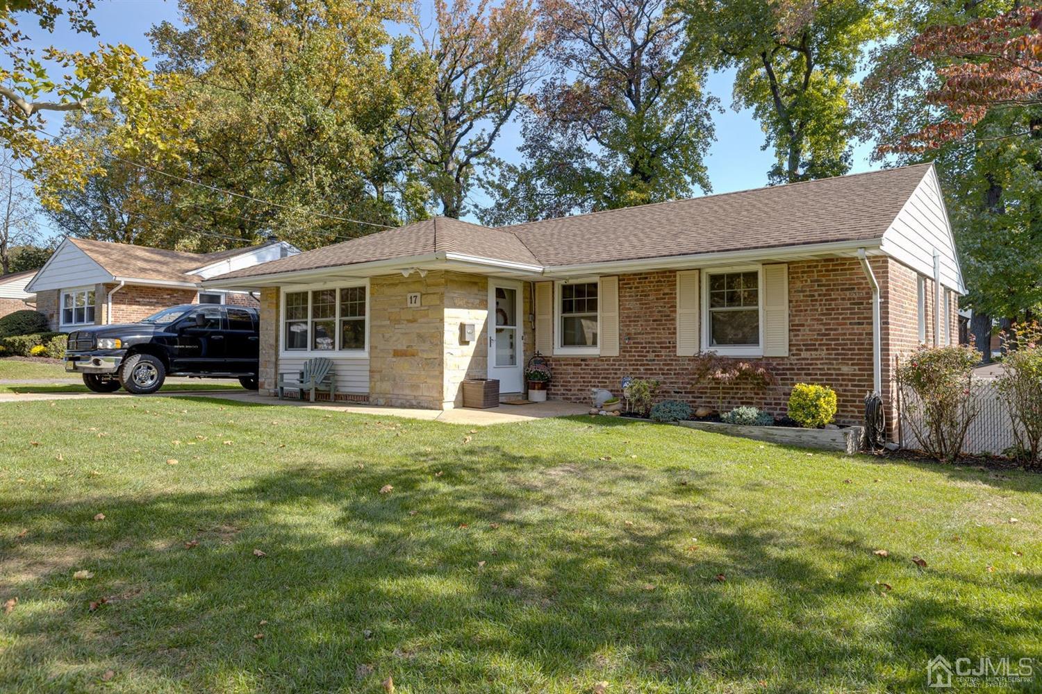 17 Melville Road Edison, NJ 08817 - Photo 5 of 26 a front view of house with yard and green space