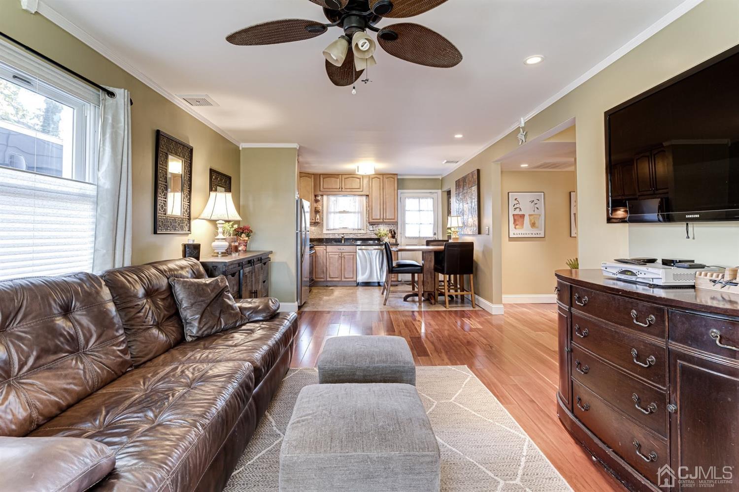 17 Melville Road Edison, NJ 08817 - Photo 8 of 26 a living room with furniture and a flat screen tv