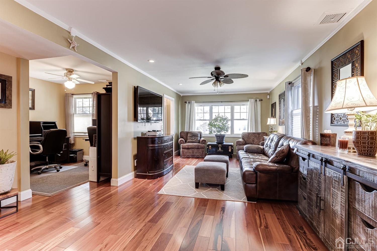 17 Melville Road Edison, NJ 08817 - Photo 9 of 26 a living room with furniture and a wooden floor
