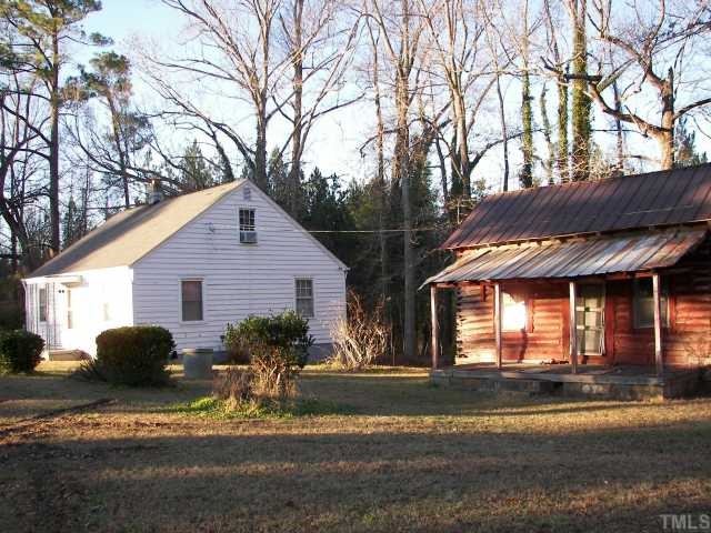 1646 Spring Valley Road Henderson, NC 27537 - Photo 3 of 3 Showing house location beside Log house