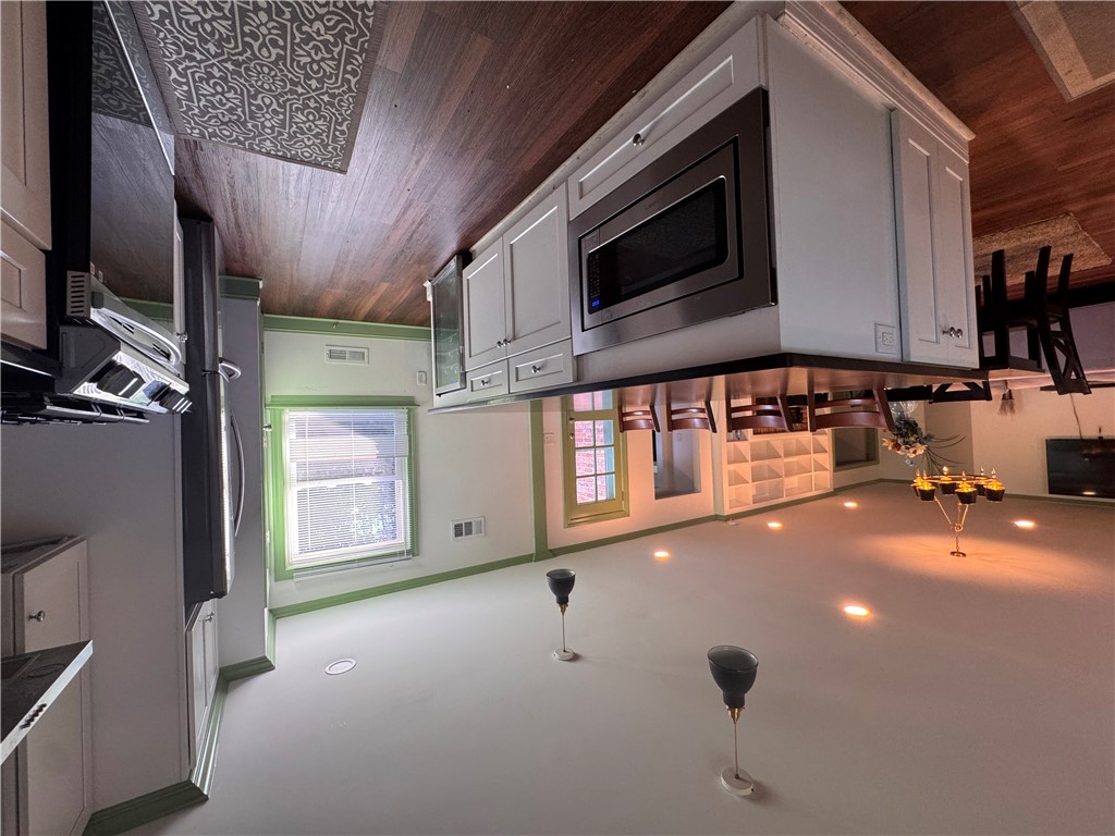 2211 East River Street Anderson, SC 29621 - Photo 21 of 40 This spacious kitchen offers a blend of style and functionality, perfect for culinary endeavors and gatherings.