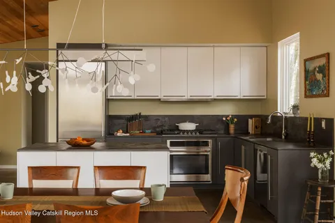 a kitchen with stainless steel appliances granite countertop a stove and a refrigerator