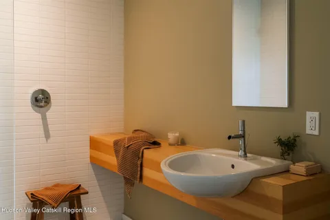 a bathroom with a sink and a mirror