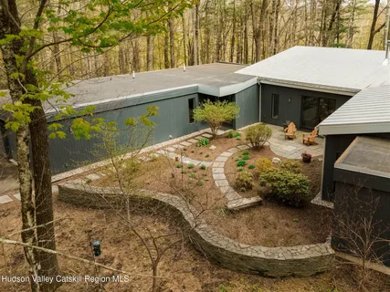 a view of a backyard of the house