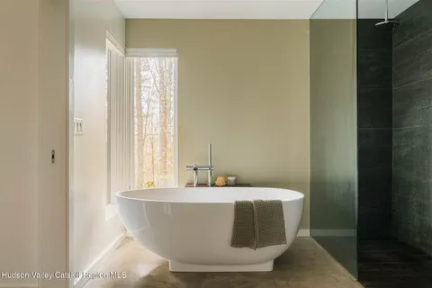 a white bath tub sitting in a bathroom