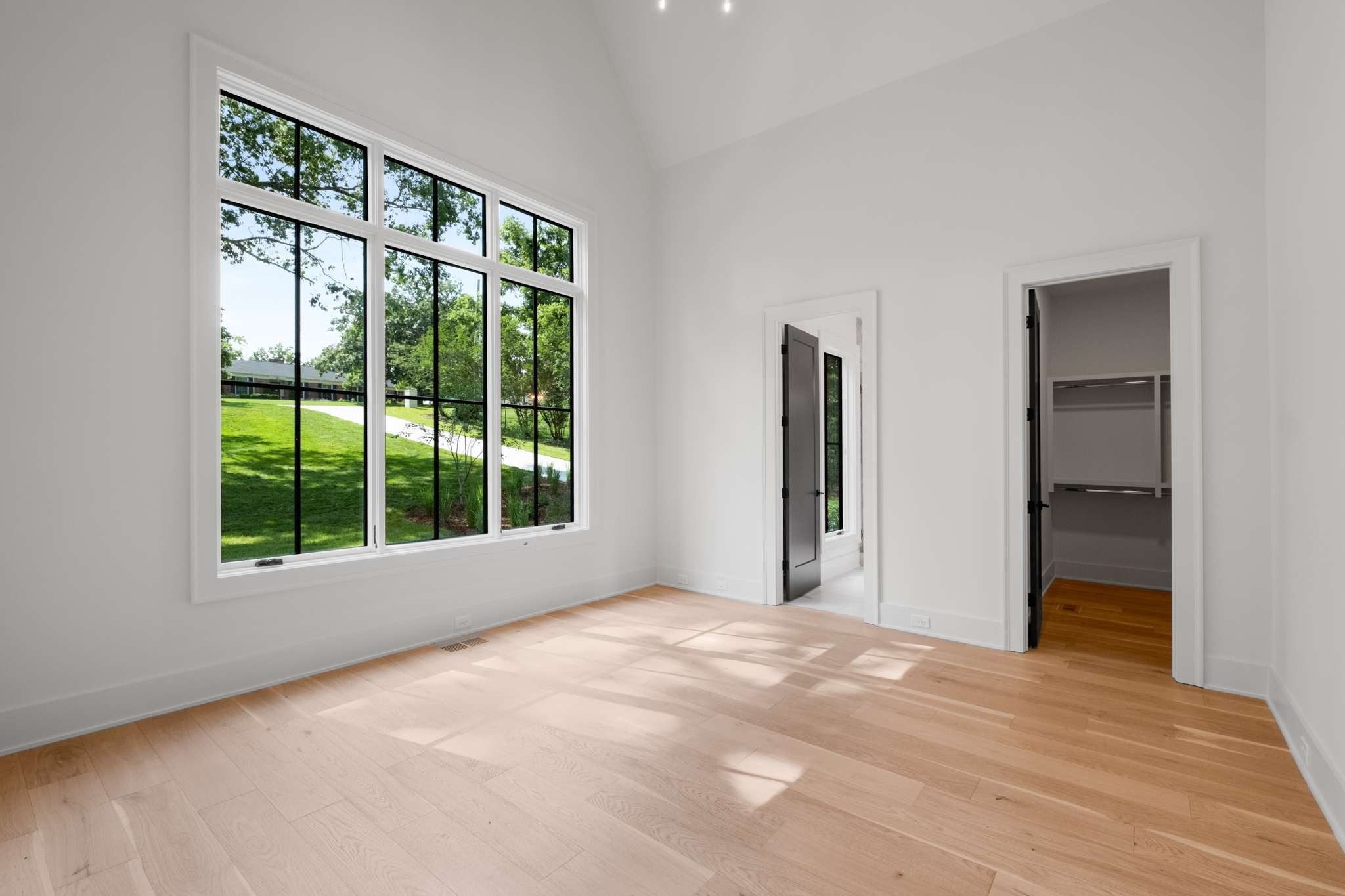 4530 Everett Drive Nashville, TN 37215 - Photo 35 of 89 a view of an empty room with a window and wooden floor