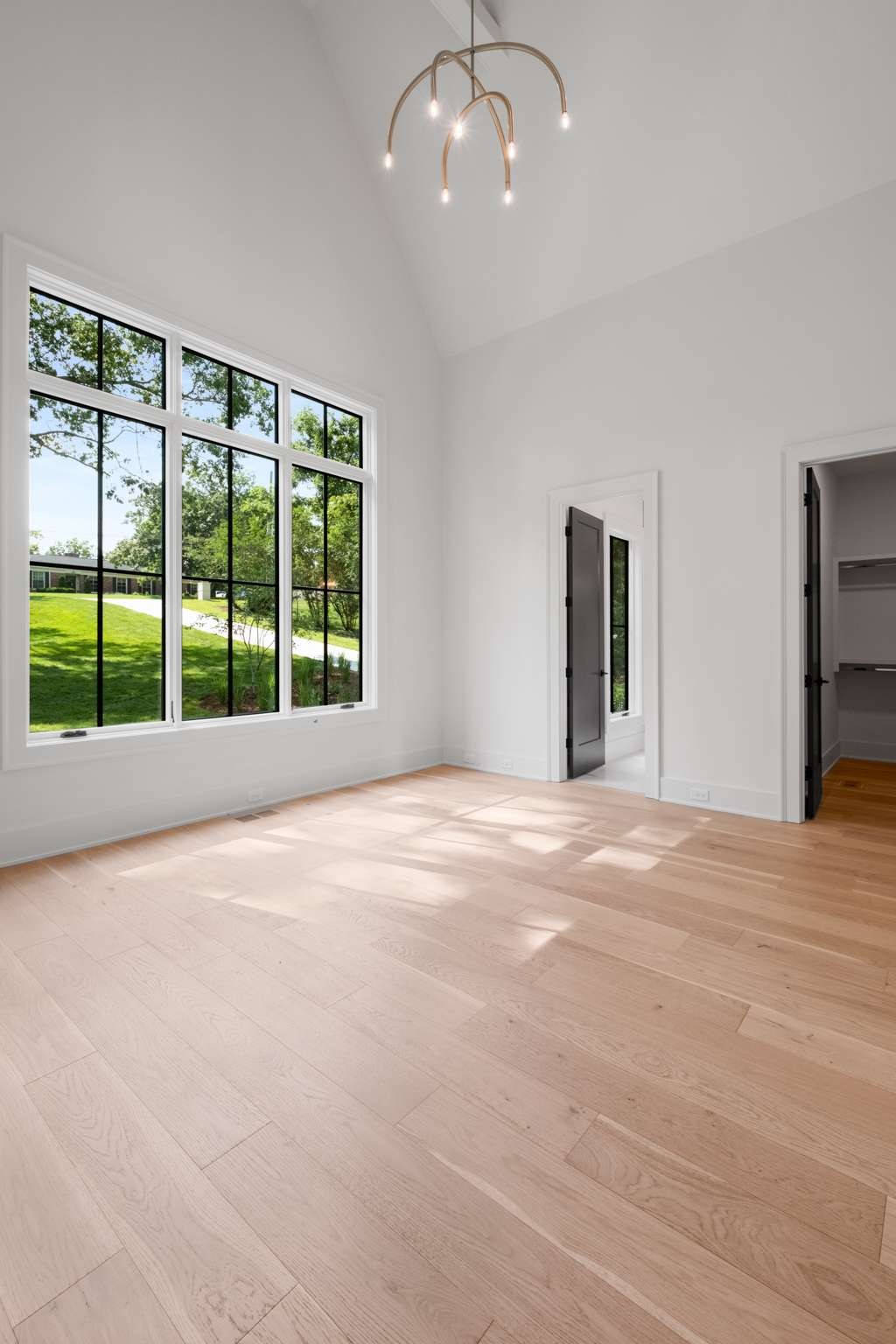 4530 Everett Drive Nashville, TN 37215 - Photo 36 of 89 a view of an empty room with a window and wooden floor