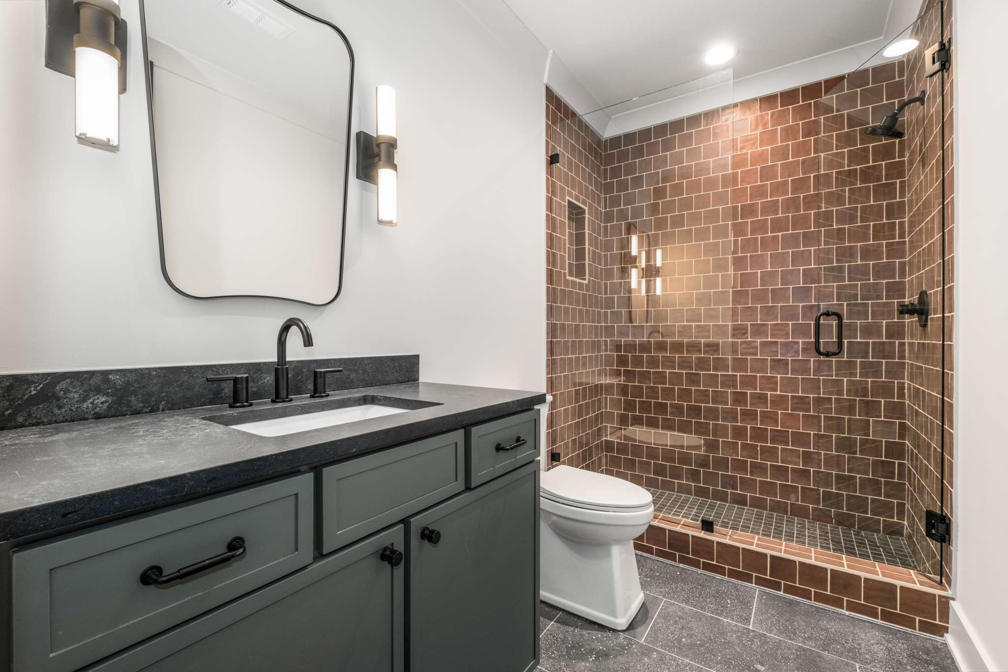 4530 Everett Drive Nashville, TN 37215 - Photo 65 of 89 a bathroom with a granite countertop toilet sink and mirror