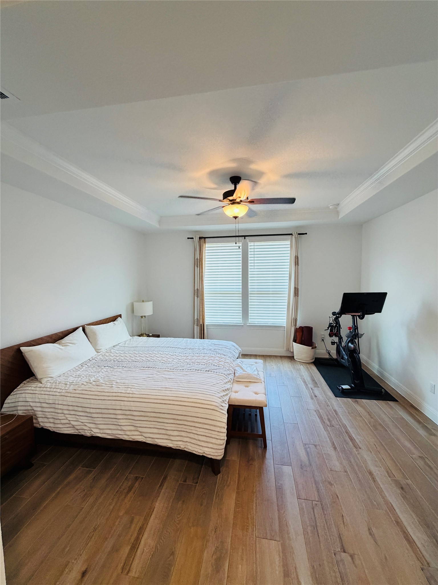 268 Fish Trap Road Dripping Springs, TX 78620 - Photo 11 of 23 Gleaming hardwood floors and a tray ceiling define this restful main-floor retreat.