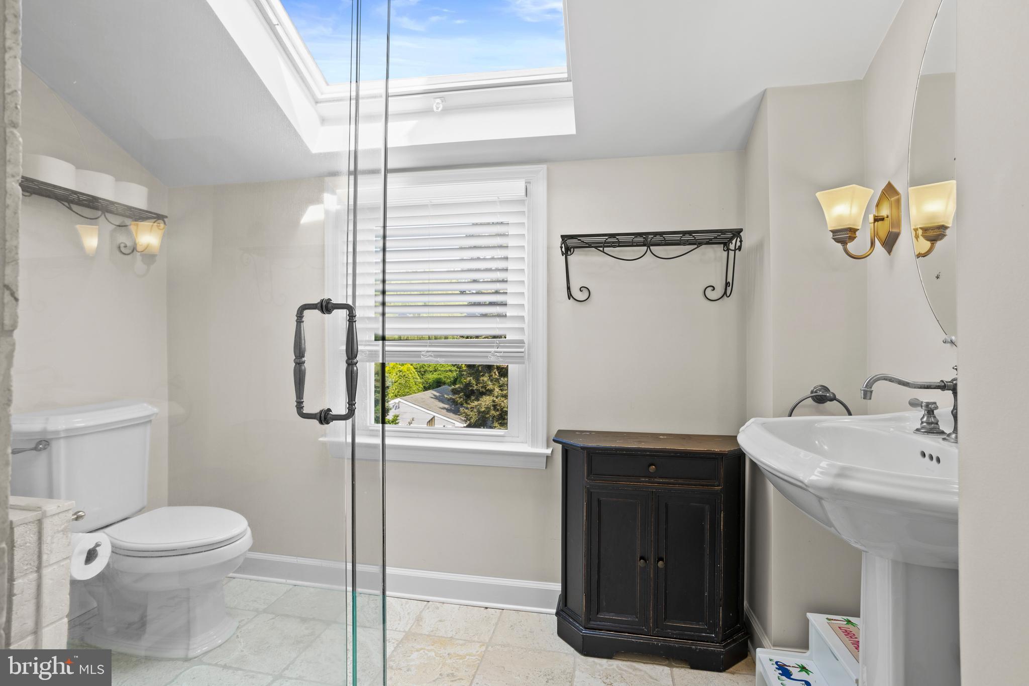 46 Plymouth Road Springfield, PA 19064 - Photo 20 of 30 a bathroom with a sink a toilet and shower