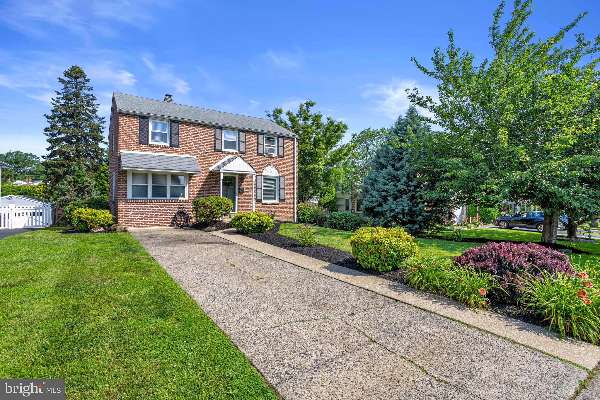 46 Plymouth Road Springfield, PA 19064 - Photo 2 of 30 a front view of a house with a yard and potted plants