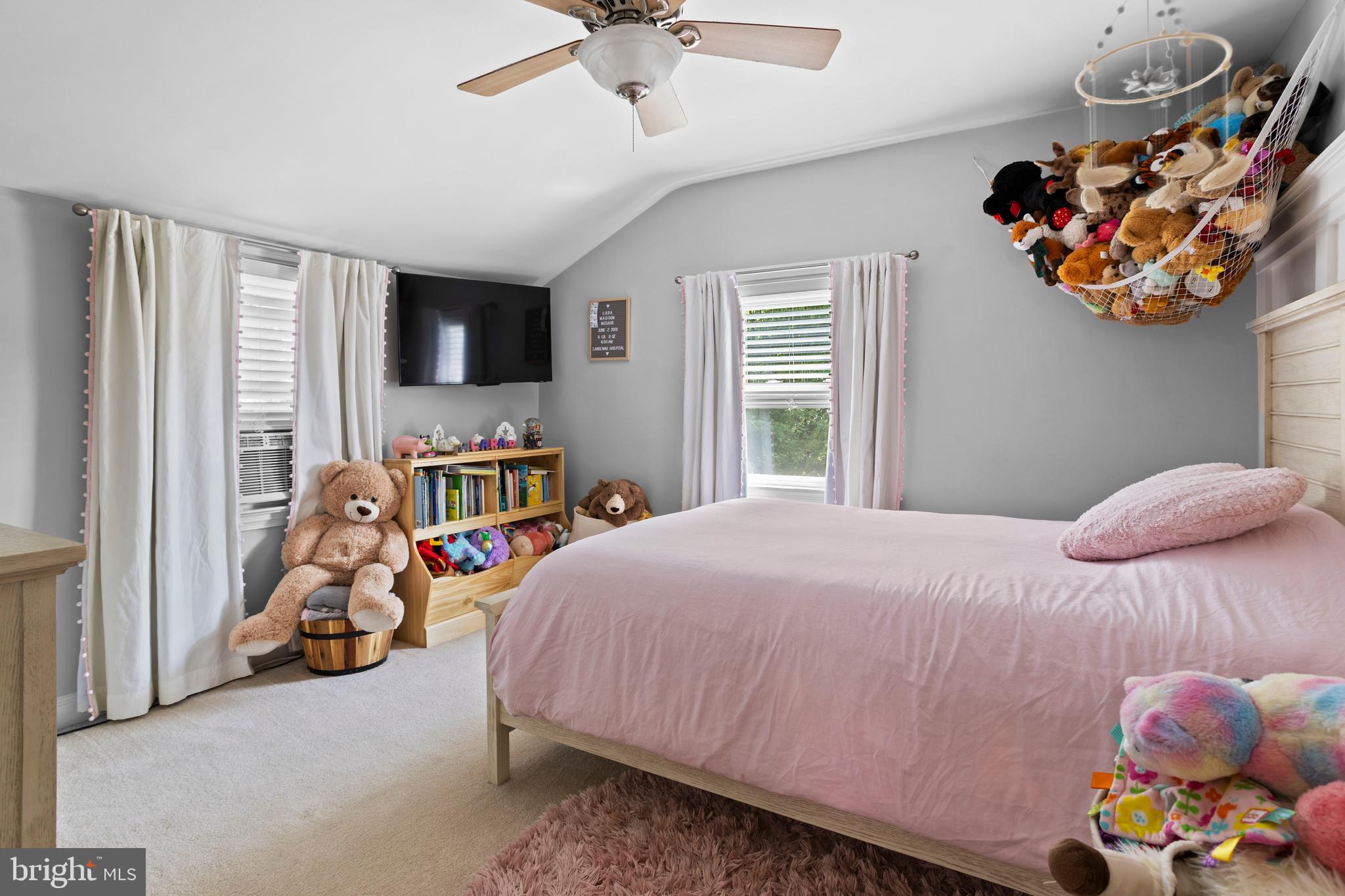 46 Plymouth Road Springfield, PA 19064 - Photo 22 of 30 a bedroom with a bed and a chandelier