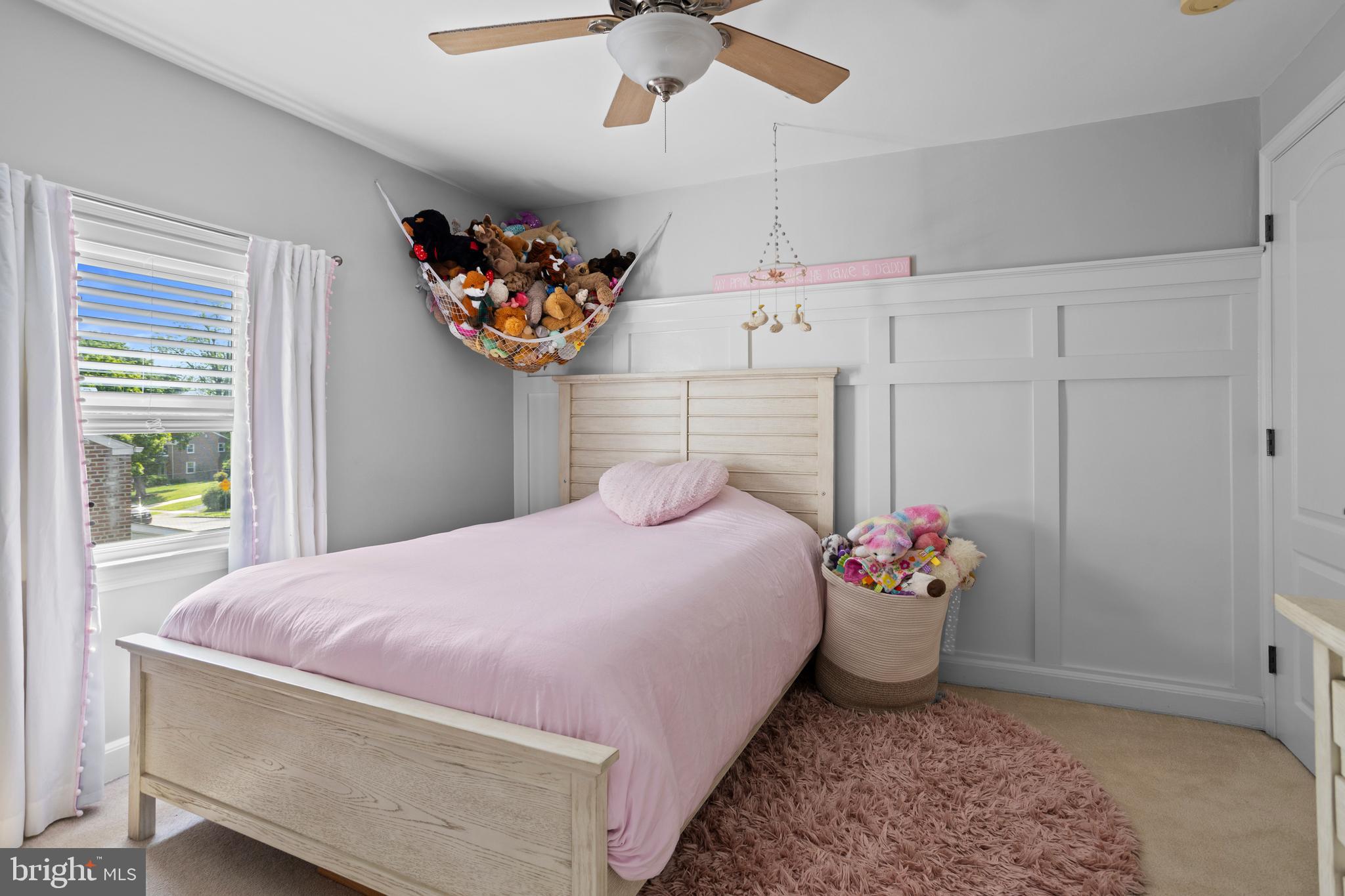 46 Plymouth Road Springfield, PA 19064 - Photo 23 of 30 a bedroom with a bed and a chandelier