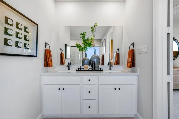 a view of a hallway with workspace and closet in a room