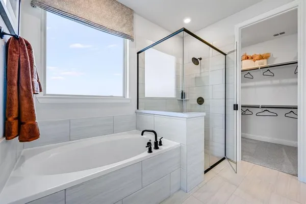 a bed room with a bed and a chandelier