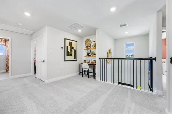 a bathroom with a bathtub shower sink vanity and toilet