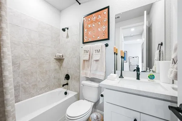 a bedroom with a large bed and a large window