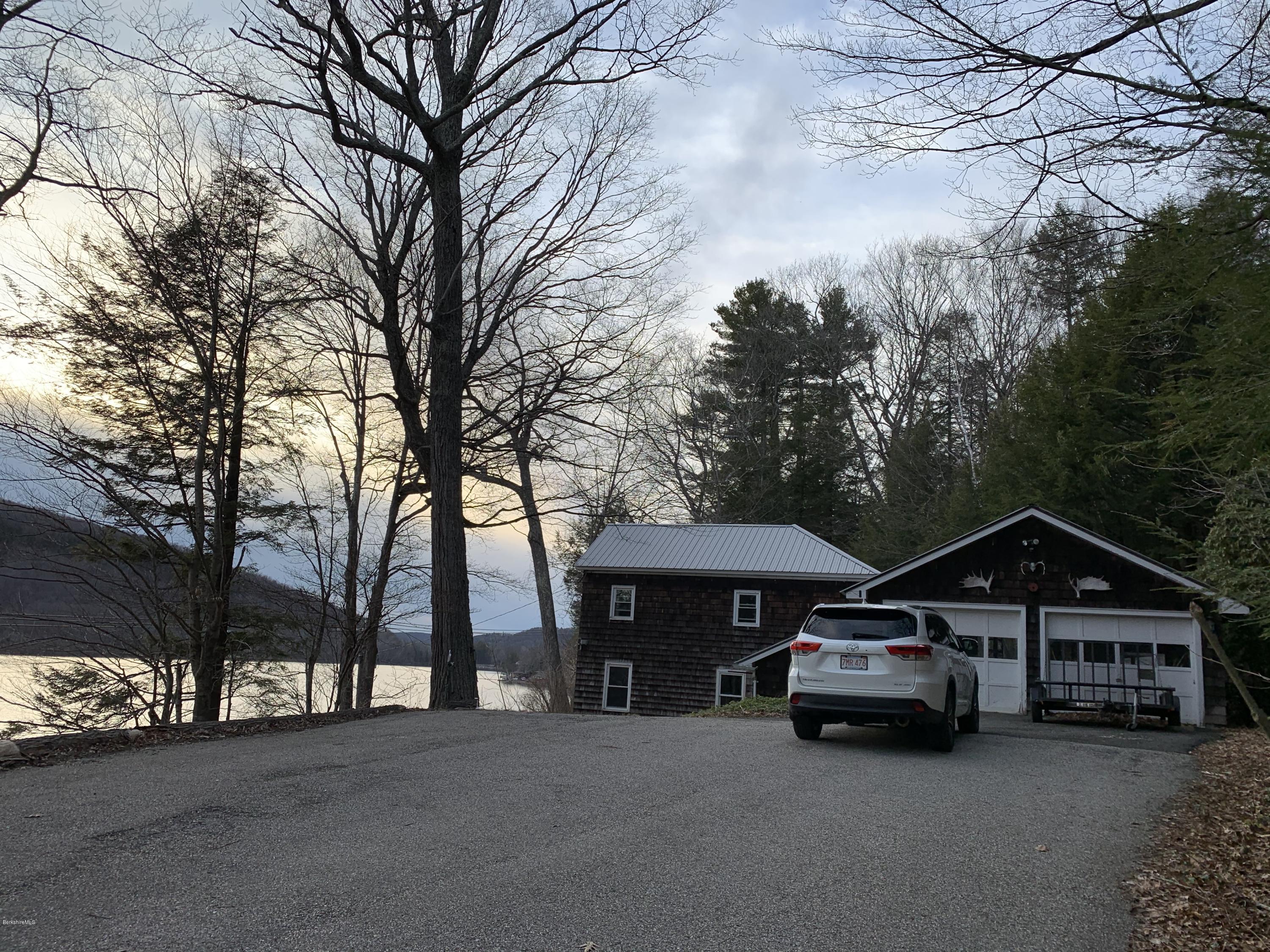 3582 Jacobs Ladder Road Becket, MA 01223 - Photo 1 of 32 a car parked in front of a house