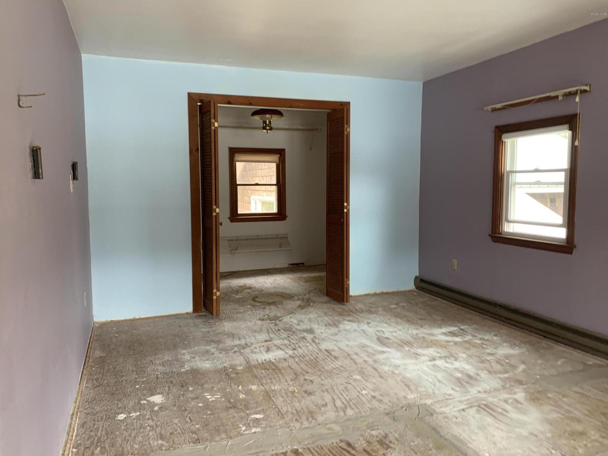 3582 Jacobs Ladder Road Becket, MA 01223 - Photo 21 of 32 an empty room with windows and closet
