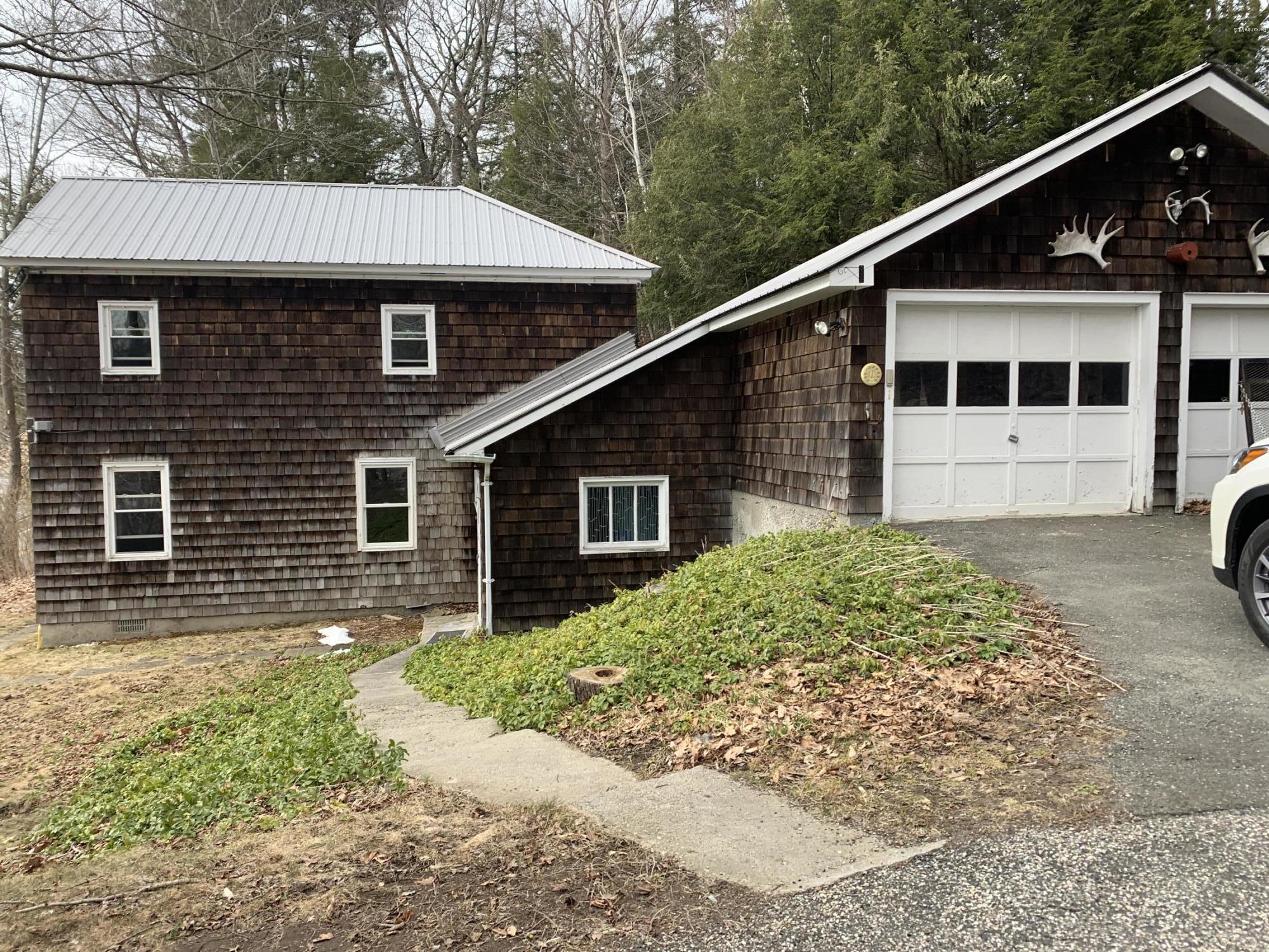 3582 Jacobs Ladder Road Becket, MA 01223 - Photo 24 of 32 a front view of a house with garden