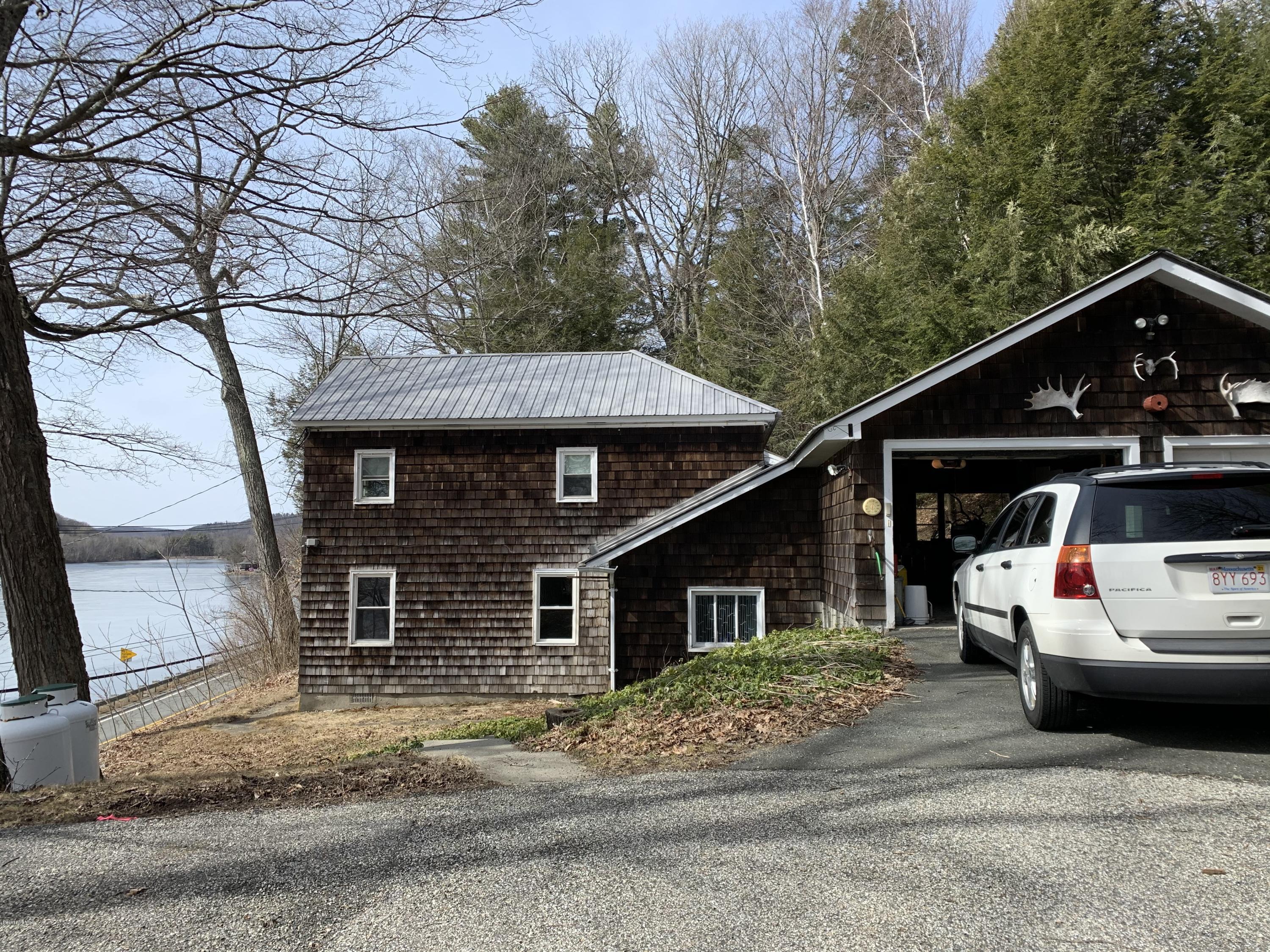 3582 Jacobs Ladder Road Becket, MA 01223 - Photo 4 of 32 a view of a house with a patio