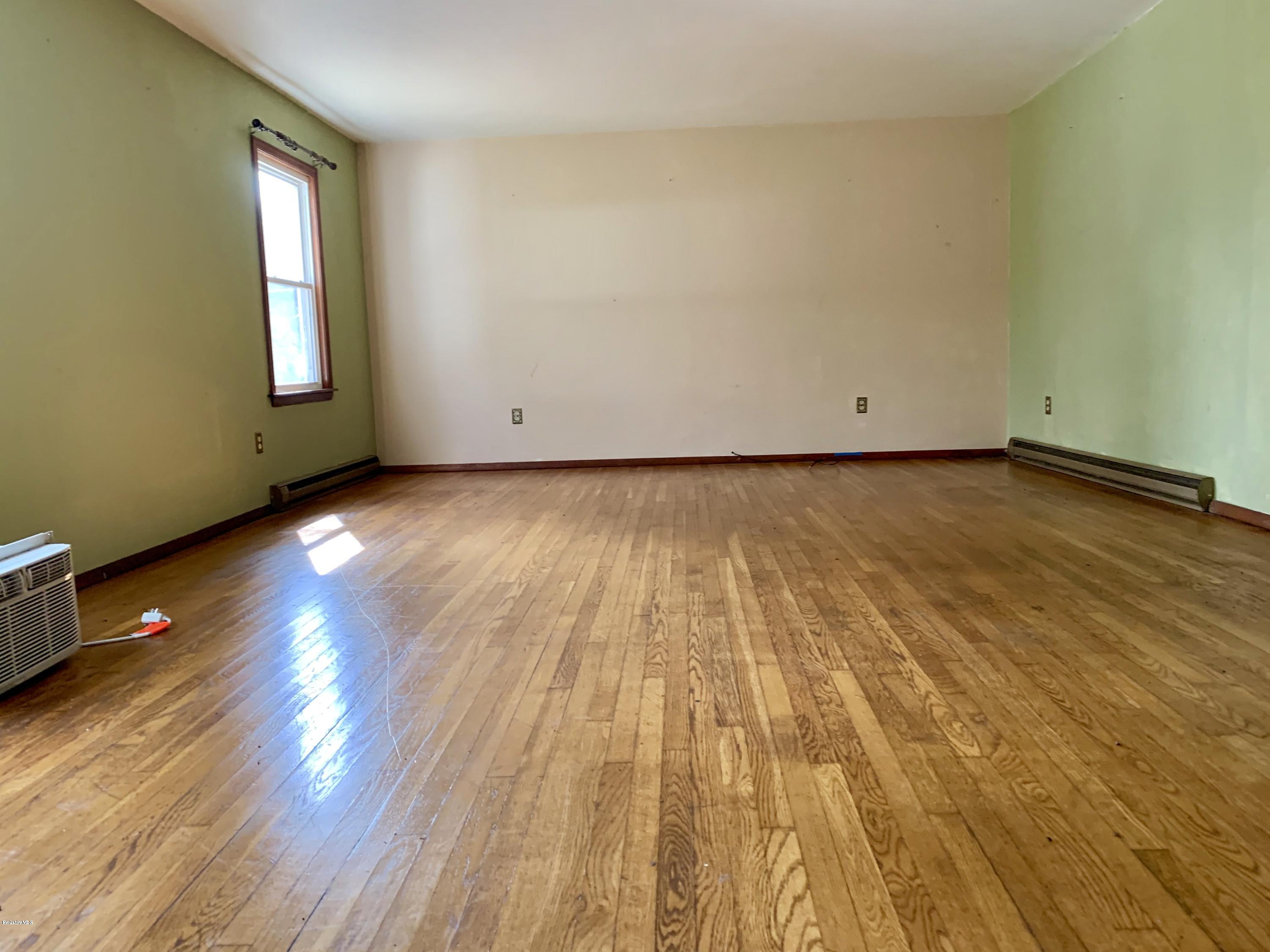 3582 Jacobs Ladder Road Becket, MA 01223 - Photo 9 of 32 a view of an empty room and wooden floor