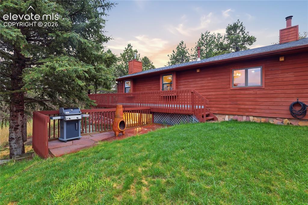 18190 Forest View Road Monument, CO 80132 - Photo 44 of 50 a view of a house with a backyard