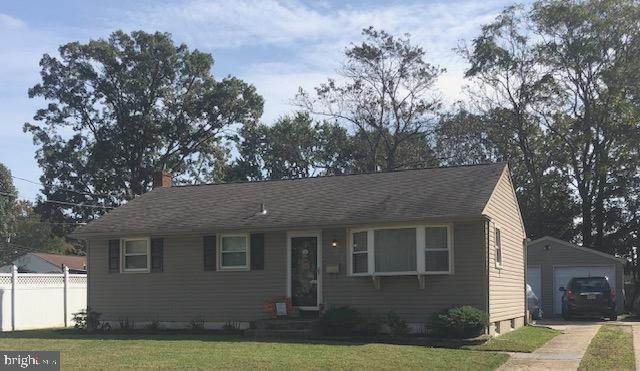 137 Estates Road Pine Hill, NJ 08021 - Photo 1 of 5 a front view of a house with garden