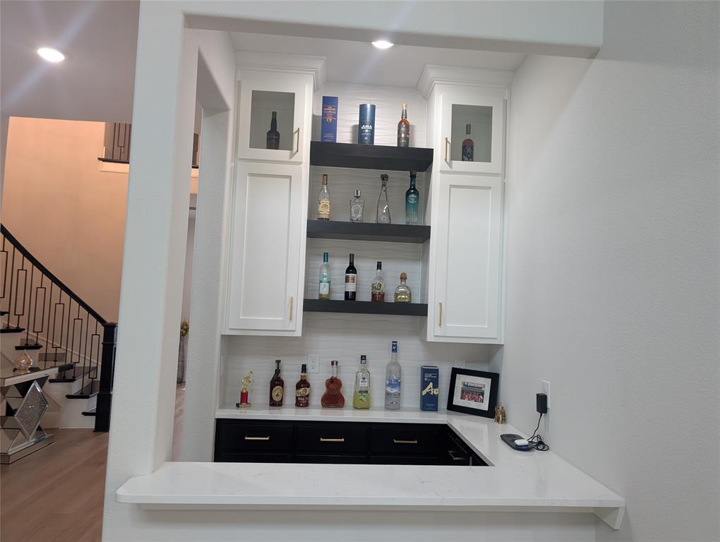 11991 Cloverdale Road Frisco, TX 75035 - Photo 16 of 40 a kitchen with stainless steel appliances granite countertop a sink and cabinets