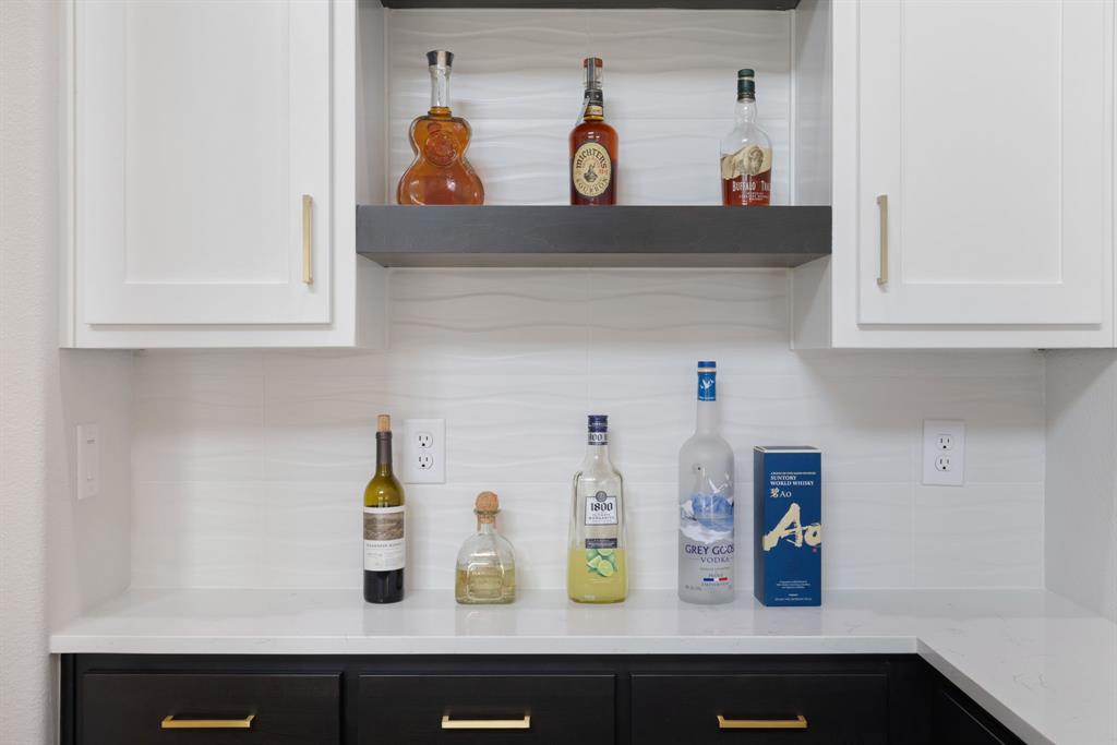 11991 Cloverdale Road Frisco, TX 75035 - Photo 18 of 40 a kitchen with a sink and wooden floor