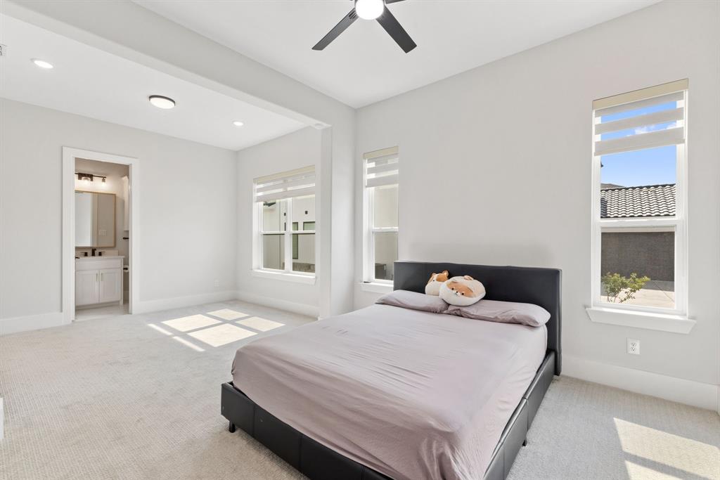 11991 Cloverdale Road Frisco, TX 75035 - Photo 23 of 40 a bedroom with a bed and a window