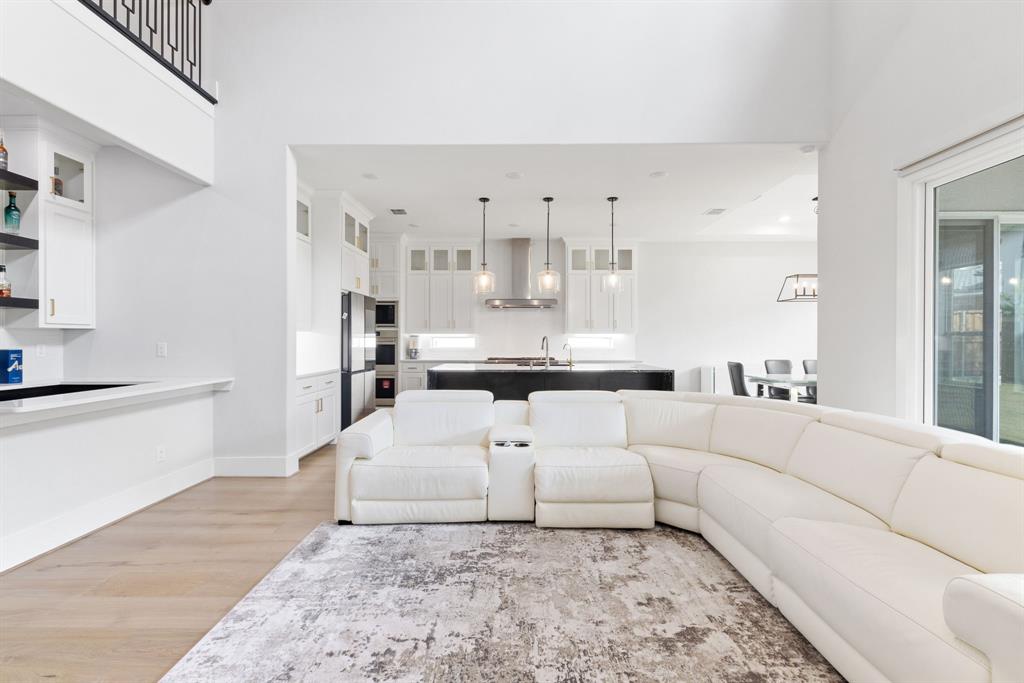 11991 Cloverdale Road Frisco, TX 75035 - Photo 4 of 40 a living room with furniture white walls and white walls