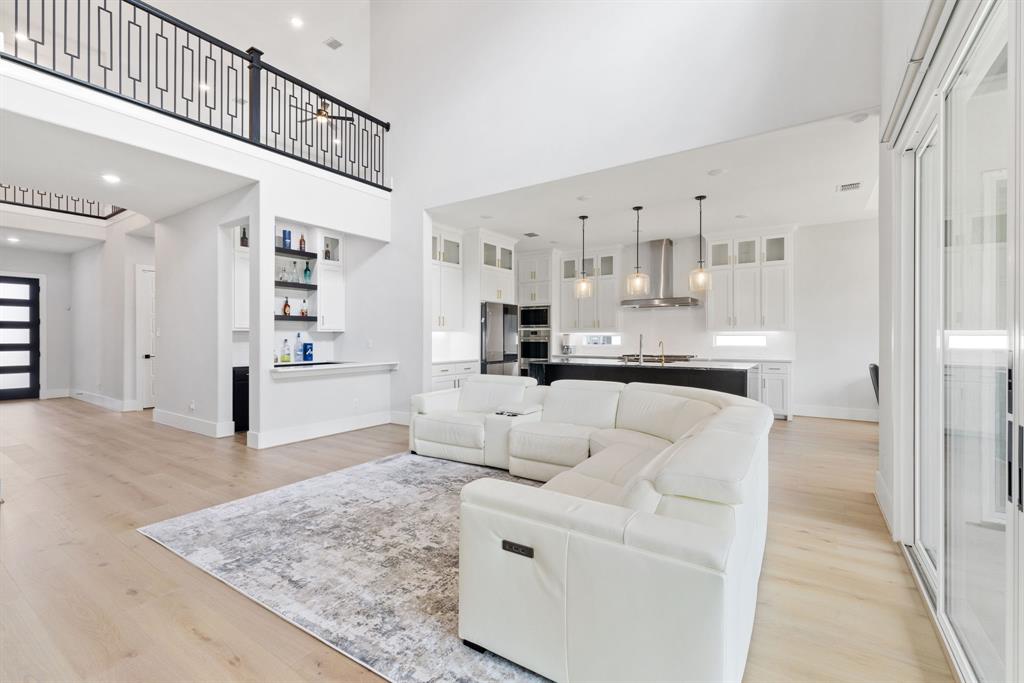 11991 Cloverdale Road Frisco, TX 75035 - Photo 5 of 40 a living room with furniture and kitchen view