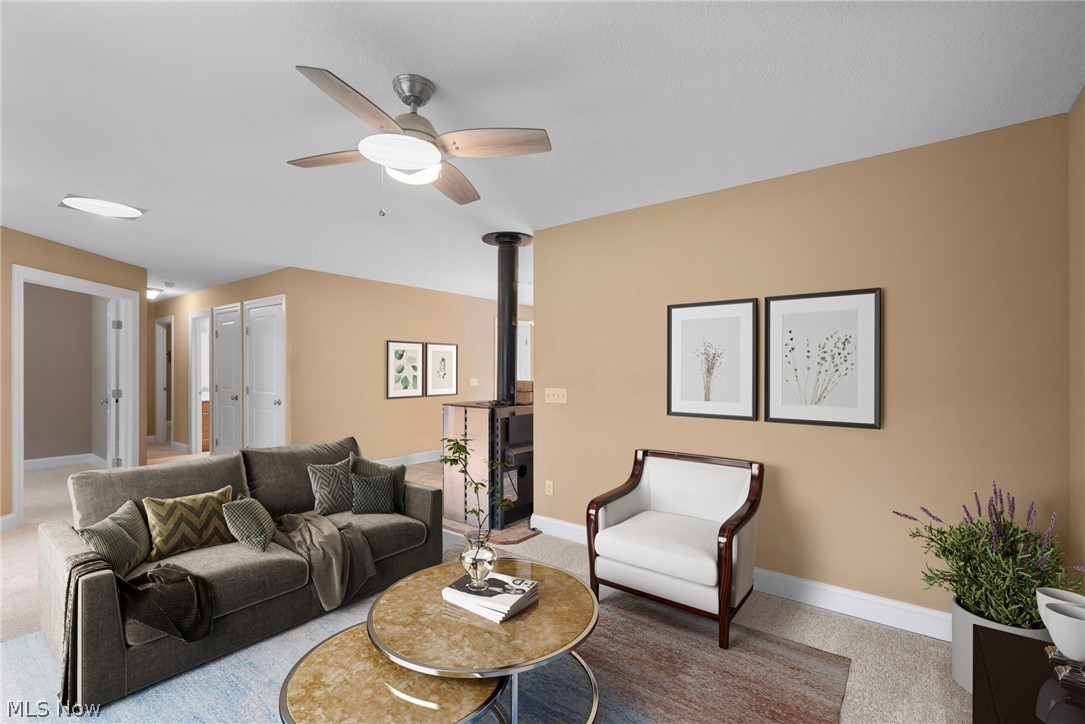 16985 Moseley Road Thompson, OH 44086 - Photo 7 of 22 Living room featuring ceiling fan and carpet floors