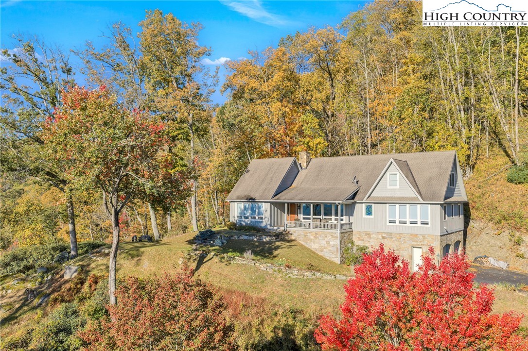 933 Thunder Ridge Lane Lenoir, NC 28645 - Photo 1 of 45 a front view of a house with a yard