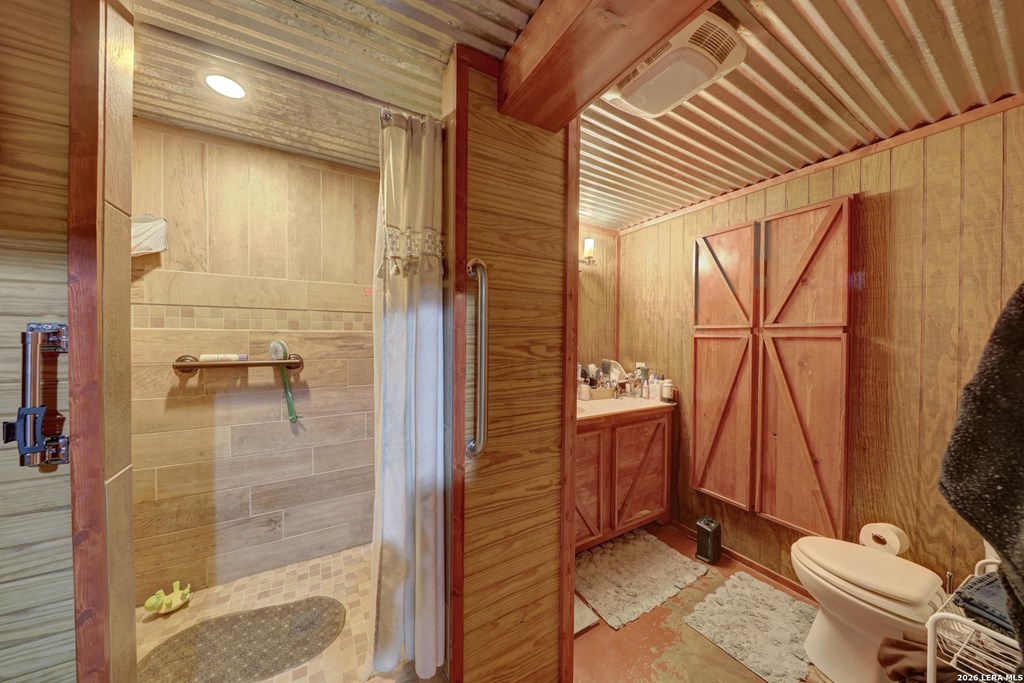 1443 Gina Road Harper, TX 78631 - Photo 11 of 49 a bathroom with a shower and a toilet