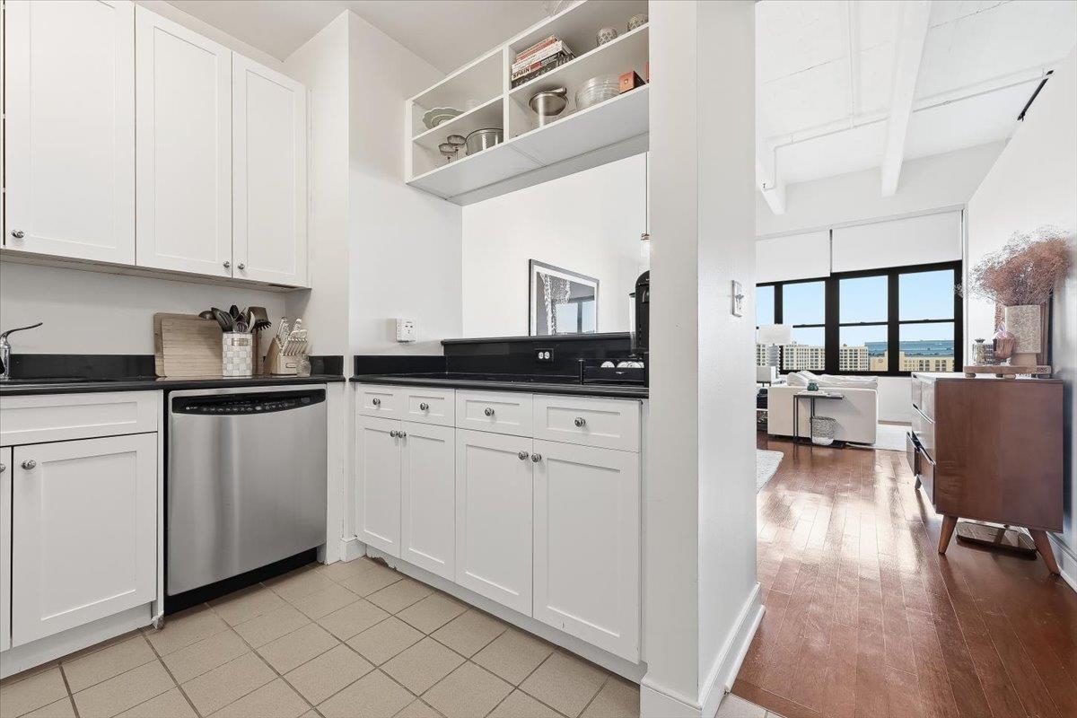 1500 Washington Street, Unit 8K Hoboken, NJ 07030 - Photo 14 of 43 a kitchen with stainless steel appliances granite countertop a refrigerator and a stove top oven