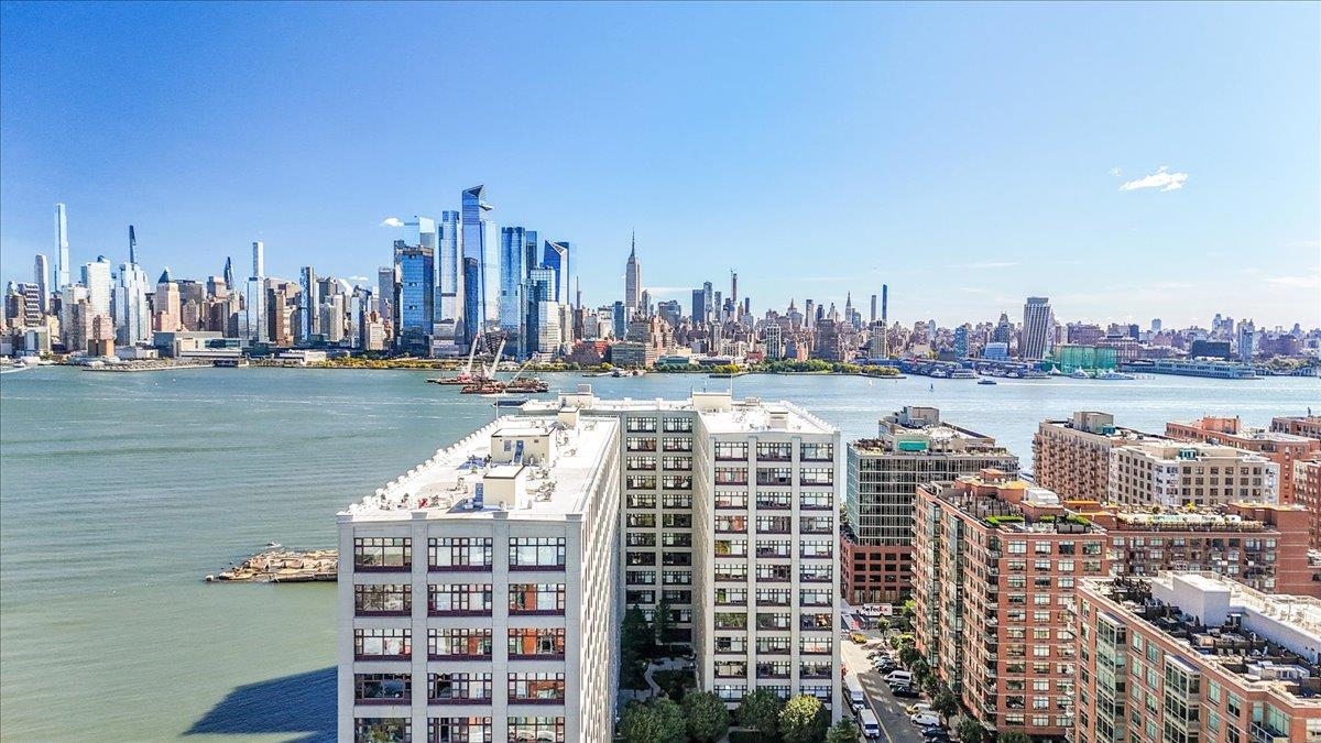 1500 Washington Street, Unit 8K Hoboken, NJ 07030 - Photo 18 of 43 a view of a city with tall buildings in front of it