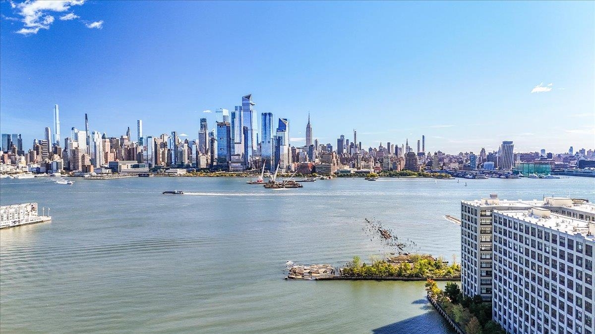 1500 Washington Street, Unit 8K Hoboken, NJ 07030 - Photo 20 of 43 a view of a ocean with tall building