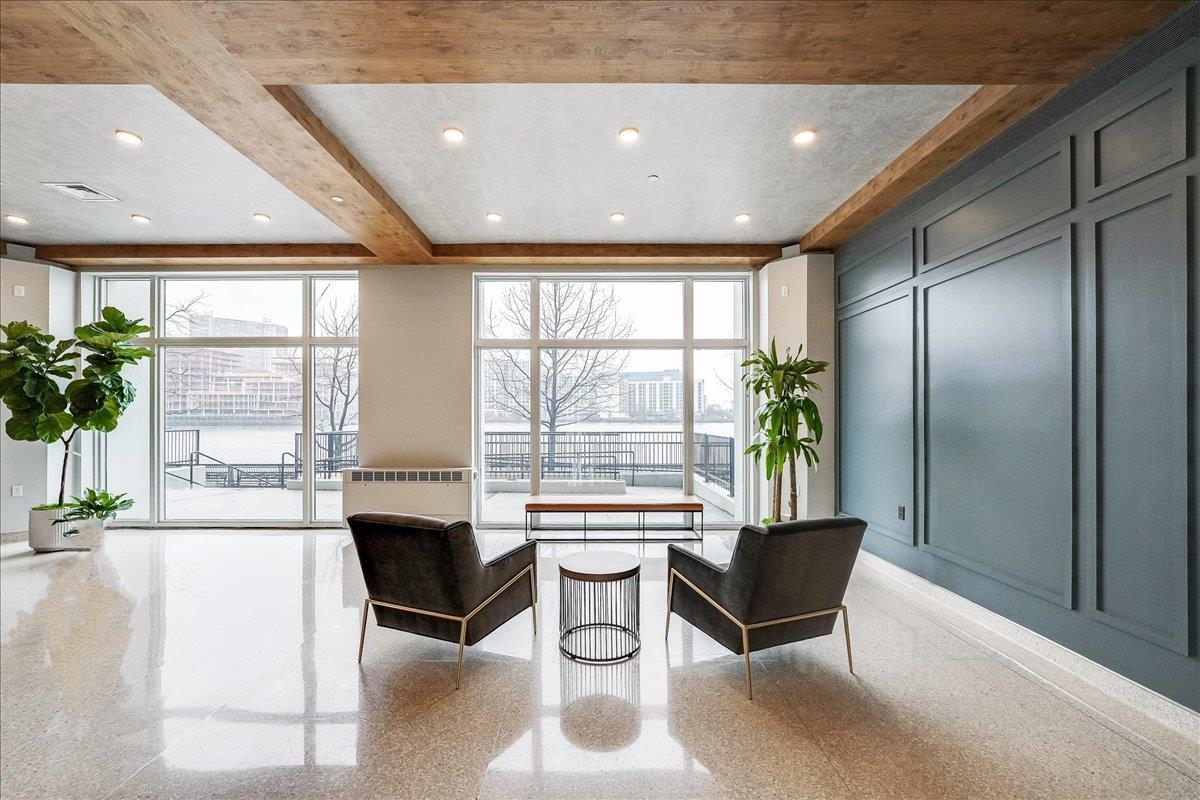1500 Washington Street, Unit 8K Hoboken, NJ 07030 - Photo 21 of 43 a lobby with furniture and large windows