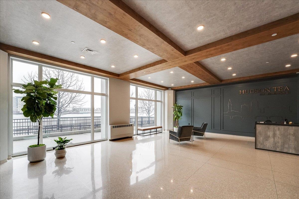1500 Washington Street, Unit 8K Hoboken, NJ 07030 - Photo 22 of 43 a living room with furniture and a large window